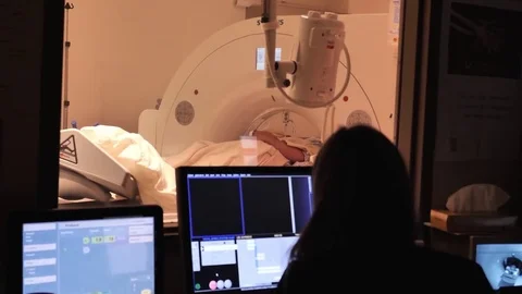X-Ray technologist performs a CT scan on an accident trauma victim Stock Footage 81036513