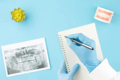 X ray of teeth with jaw model on dentist table Stock Photos