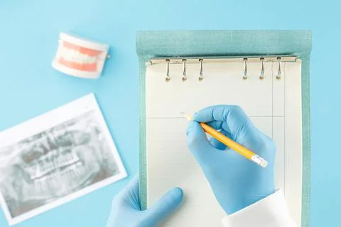 X ray of teeth with jaw model on the dentist table Stock Photos