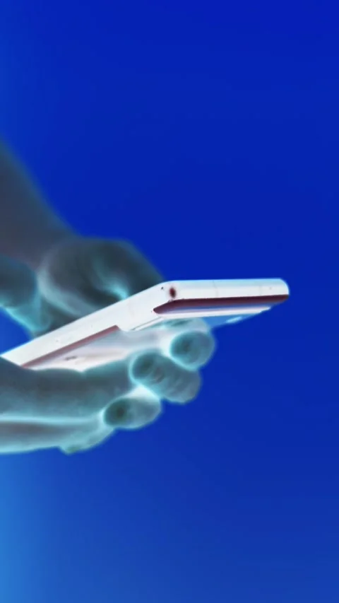 X-ray vision effect of hands using a modern smartphone, showcasing mobile t.. Stock Footage 342927170