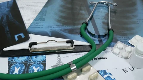 X-rays on the table in the doctor's office Stock Footage 87358906