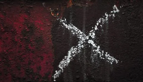 The x sign is drawn in chalk on an old painted metal texture with rust Stock Photos