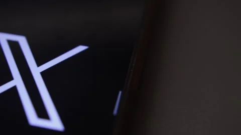 X twitter social media app. x twitter app icon logo on the phone display. Stock Footage 258930220