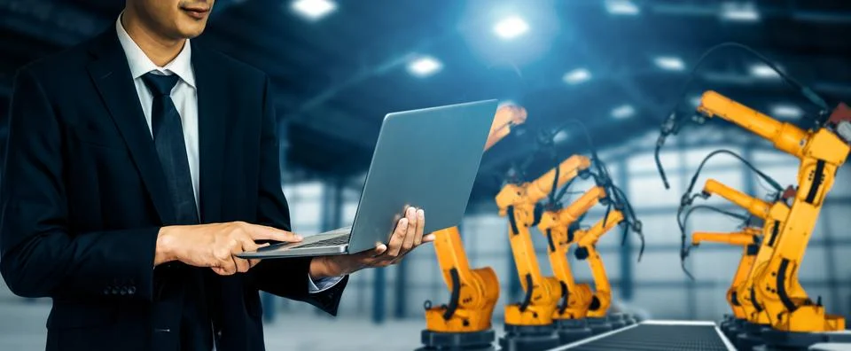 XAI Engineer use advanced robotic software to control industry robot arm in 스톡 사진