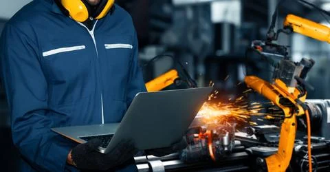 XAI Engineer use advanced robotic software to control industry robot arm in Foto stock