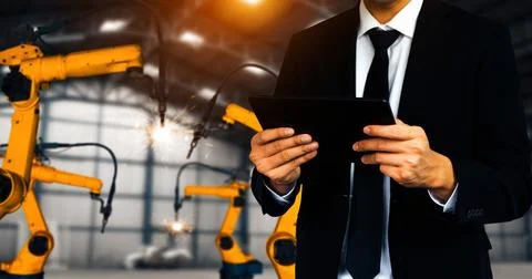 XAI Engineer use advanced robotic software to control industry robot arm in 스톡 사진