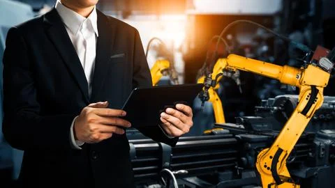 XAI Engineer use advanced robotic software to control industry robot arm in 스톡 사진