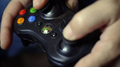 Xbox controller, children's hands play Stock Footage 129895305