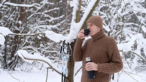 XC skier drinking coffee in winter forest Stock Footage 335237337