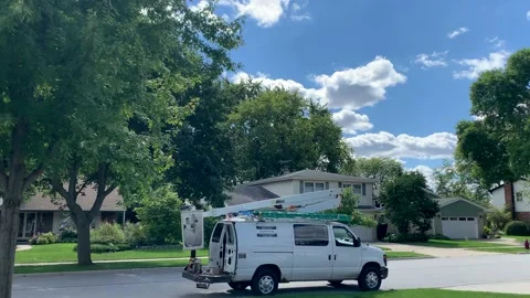Xfinity-Comcast technician van parked in neighborhood on a sunny day, no Stock Footage 218664579