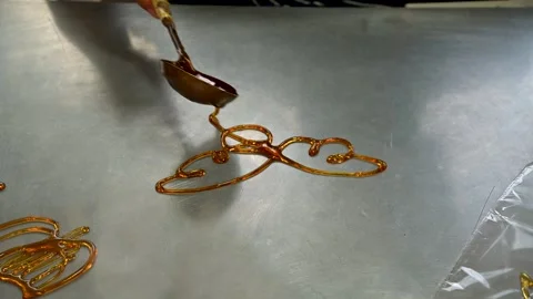 XI'AN, CHINA – 2024/10/14: Artisan Creating Traditional Sugar Painting Stock Footage 342321831