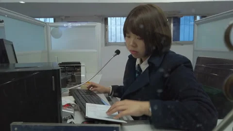 XI'AN, CHINA - FEB 01, 2019: Passengers at the ticket window of the railway Stock Footage 123717619