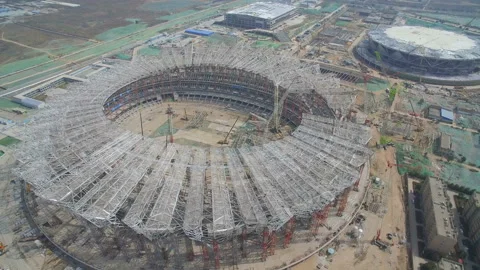 XI'AN, CHINA - MARCH 25, 2019: AERIAL shot of stadium being built,China Stock Footage 120510334