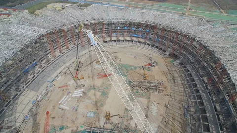 XI'AN, CHINA - MARCH 25, 2019: AERIAL shot of stadium being built,China Stock Footage 149707780