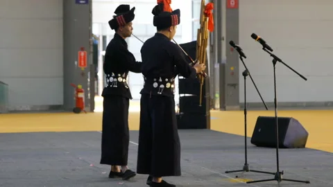 XI'AN, CHINA - MARCH 30, 2019: View of performers perform Miao nationality Stock Footage 211941470