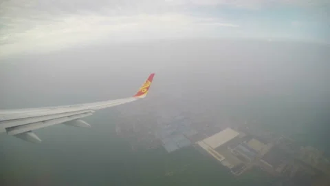 XI'AN, CHINA - MAY 17, 2018: Airplan wing through cloud.,China. Stock Footage 121292160