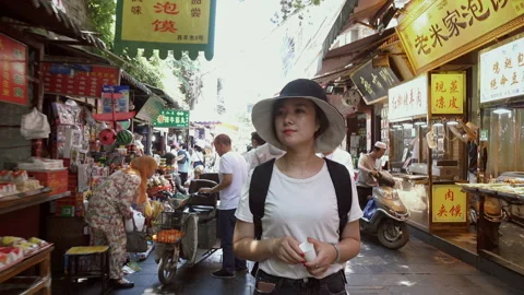 Xi'an, Shaanxi, China, JUNE 13, 2019. view of female tourists visiting the Stock Footage 123987166