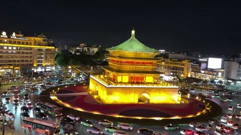 Xian Bell Tower night view with traffic flow around roundabout China Stock Footage 335809755