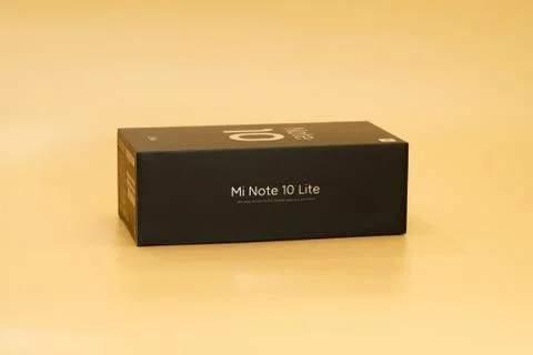 Xiaomi mi note 10 lite new phone box, black on peach colored background Stock Photos