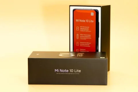 Xiaomi mi note 10 lite new phone box, black on peach colored background Stock Photos