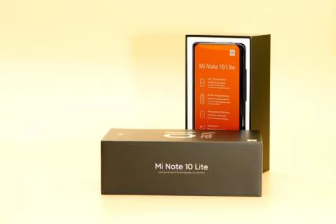 Xiaomi mi note 10 lite new phone box, black on peach colored background Stock Photos