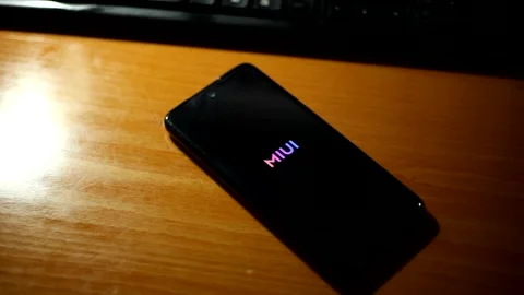 Xiaomi phone displaying update text message MIUI Android version. Stock Footage 157674827
