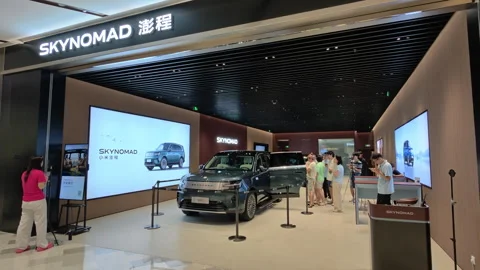 Xiaomi SkyNomad N90 EREV SUV car exhibit in store Stock Footage 341184367