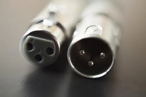 Xlr audio cable on top of a black table. Connections on display. xlr cable co Photos