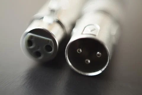 Xlr audio cable on top of a black table. Connections on display. xlr cable co Foto stock