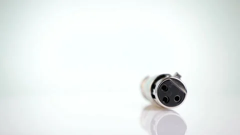 XLR connector rotating on a white background Stock Footage 130562923