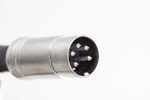 XLR din plug connector close up shot with visible connection pins isolated on Stock-Fotos
