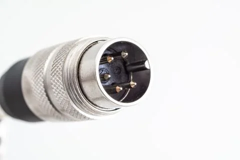 XLR din plug connector close up shot with visible connection pins isolated on Stock Photos