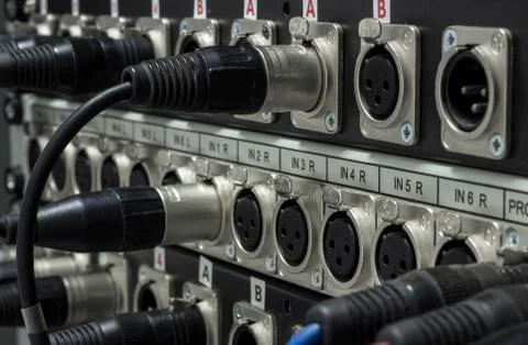 XLR jack cable connected at rear end of  equipment Foto stock