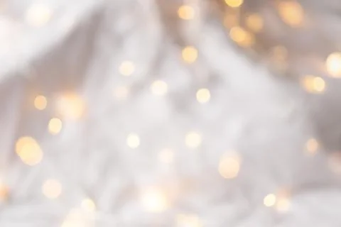 Xmas backdrop. Festive soft background with yellow bokeh of the garland Stock Photos
