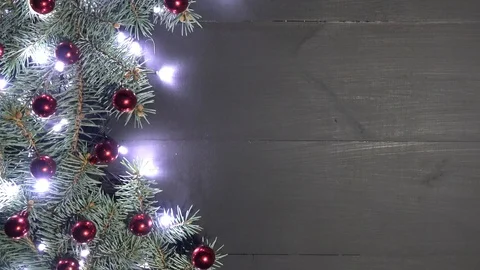Xmas background with pine branches decorated with baubles and brilliant lights Stock Footage 99058475