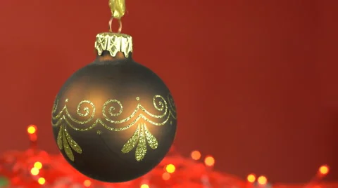 Xmas bauble looping on red background Stock Footage 68956837