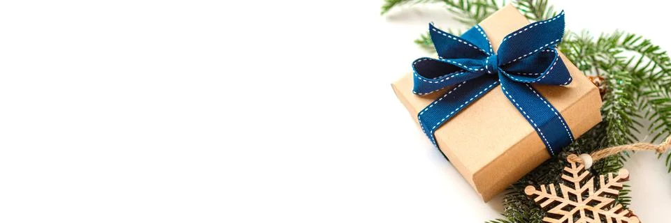 Xmas composition with present box decorations, wooden snowflakes, fir tree Stock Photos