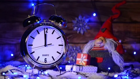 Xmas set with big alarm clock counting to twelve o'clock Stock Footage 69739749