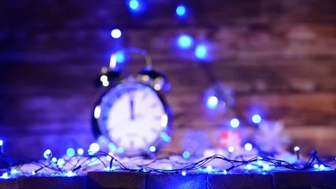 Xmas set with big alarm clock counting to twelve o'clock Stock Footage 69739807