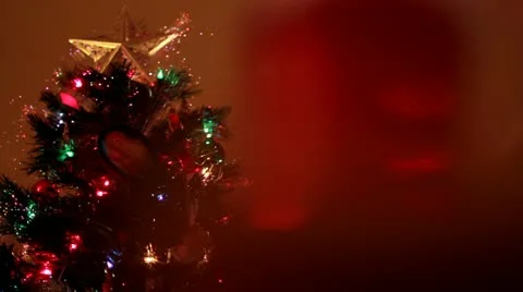 Xmas tree dolly out and rack focus reveals partially drank mug of beer Stock-Footage 12720432
