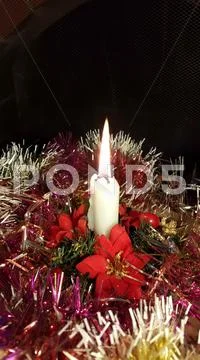 Xmas White Candle light closeup and dark background Stock Photos