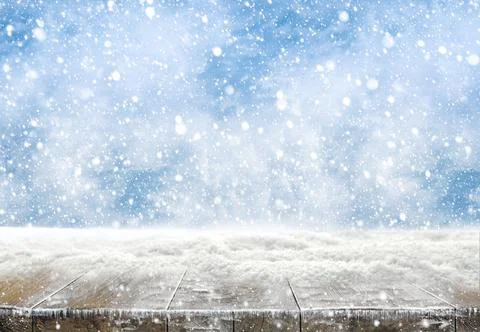 Xmas winter background and rustic table of wood with snow on top. Stock Photos