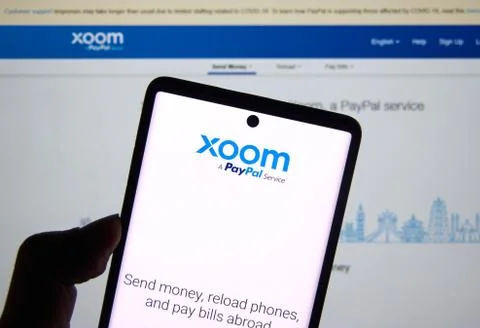 Xoom mobile application and logo. It is a PayPal service of electronic funds  Stock Photos