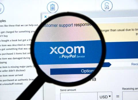 Xoom web site and logo. Xoom is a PayPal service of electronic funds transfer Stock Photos
