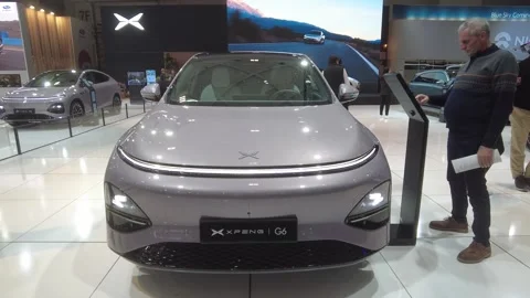 Xpeng g6 awd performance black edition makes premiere 2026 brussels motor show Stock Footage 328207875