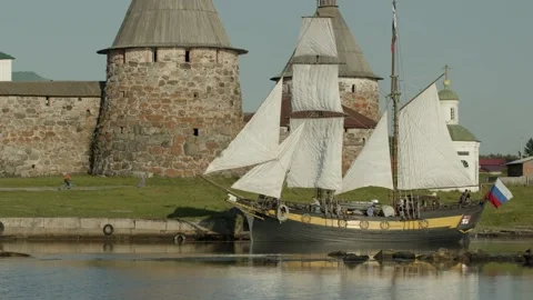 Yacht along the walls of the monastery Stock Footage 148431341