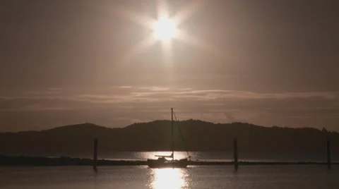 Yacht backlit at Waitangi Stock Footage 39610496