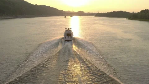 Yacht going at full speed at sunset along the Dnieper Stock Footage