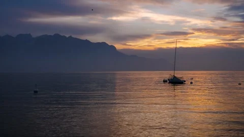A yacht on the lake in the rays of the setting sun Stock Footage 303529844