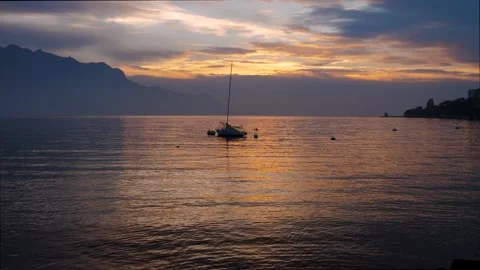 A yacht on the lake in the rays of the setting sun Stock Footage 303529846
